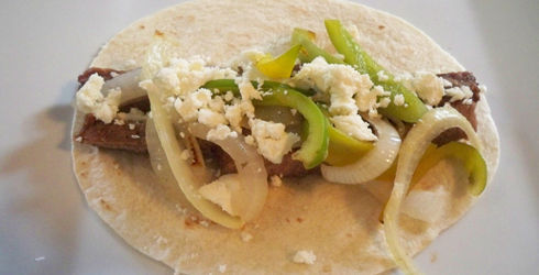 One thing I love about Fajitas are their simplicity.  All you need to make a wonderful meal is a good piece of steak, peppers and onions, tortillas, some cheese, and if desired lettuce, sour cream and a touch of salsa.