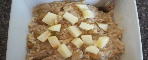 Oven Apple Oats is a very creamy and fluffy oatmeal that is lighter than bread pudding, but somewhat reminiscent of it. This sweet combination of apples, maple syrup, and currants is one of The Hungry Wife's favorite oatmeals.