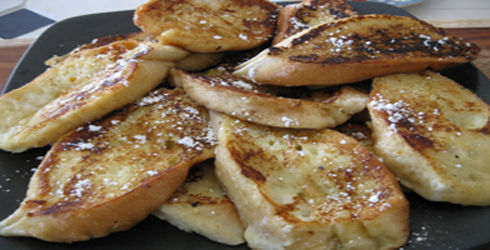 French toast is called Pain Perdu, or "lost bread," because it is made from stale bread.  What makes this Pain Perdu Breakfast different from regular French toast, hard bread is softened by dipping in a mixture of milk and eggs, then deep fried.